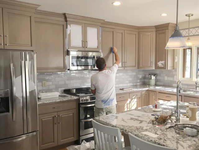 Before-and-after view of kitchen painting by New Franklin House Painters in New Franklin